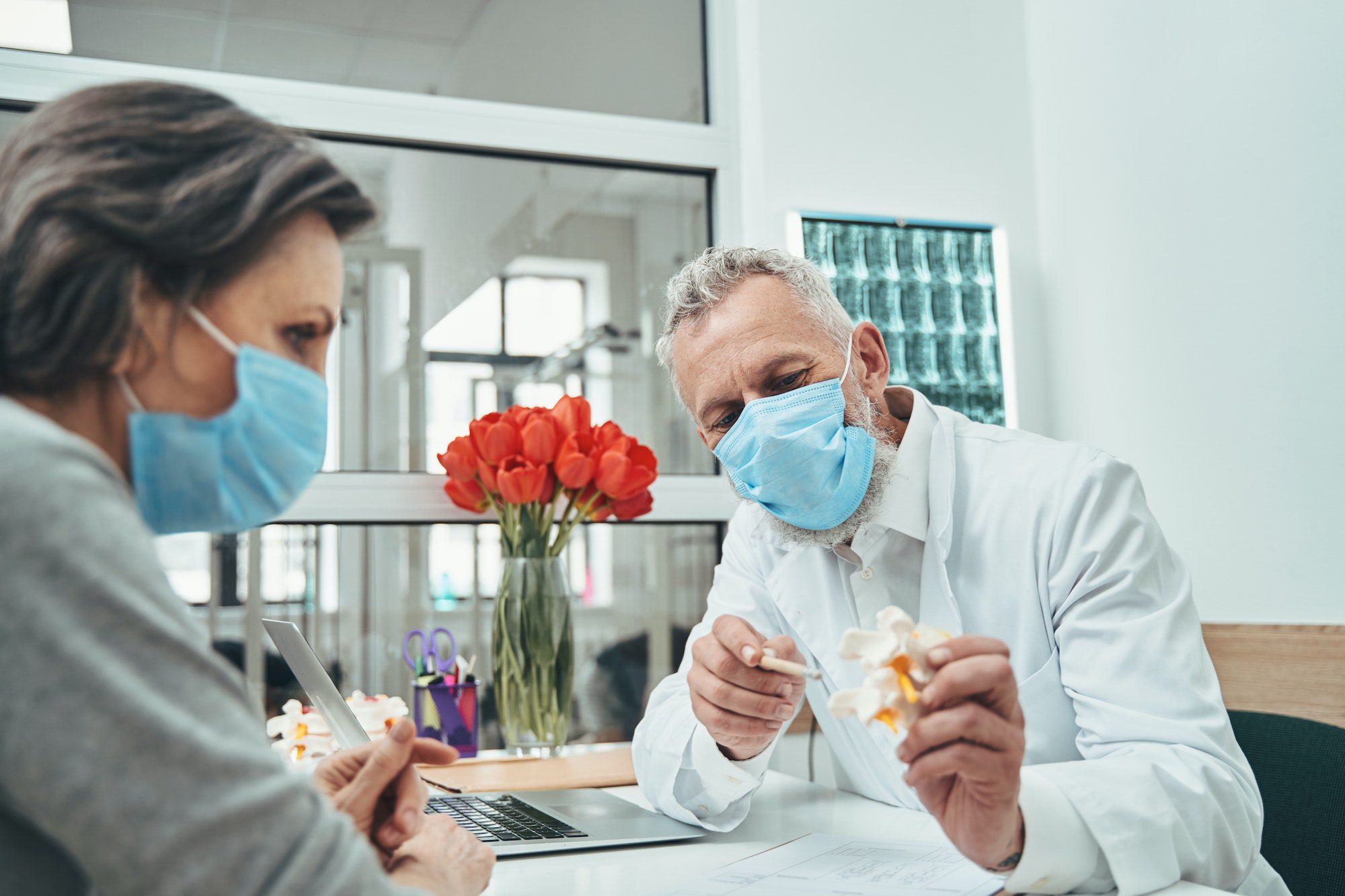 Doctor conducting a female patient initial consultation