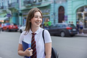 Portrait of smiling girl student with braces on her teeth