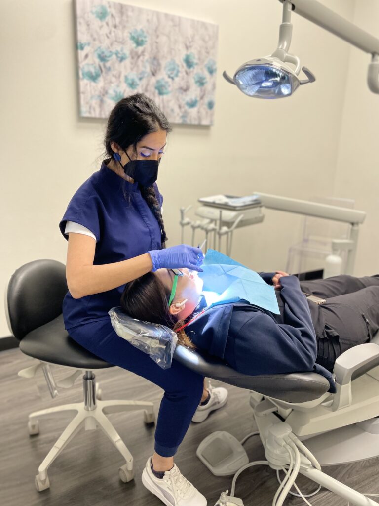 Patient receiving comprehensive dental treatment from a dentist in Austin, TX at Celebrate Dental & Braces