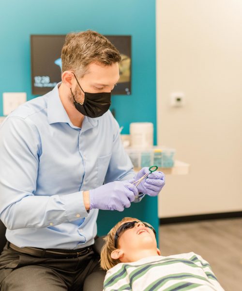 Patient receiving dental treatment from our specialist orthodontist in Austin, TX at Celebrate Dental & Braces