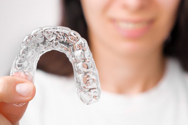 close-up-orthodontic-transparent-aligner-in-womans-2021-10-07-16-42-25-utc-min