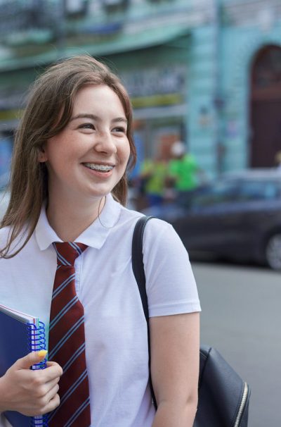 Portrait of smiling girl student with braces on her teeth